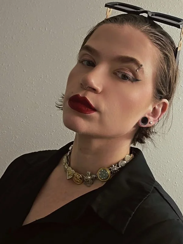 slicked back short beach hairstyle bold look