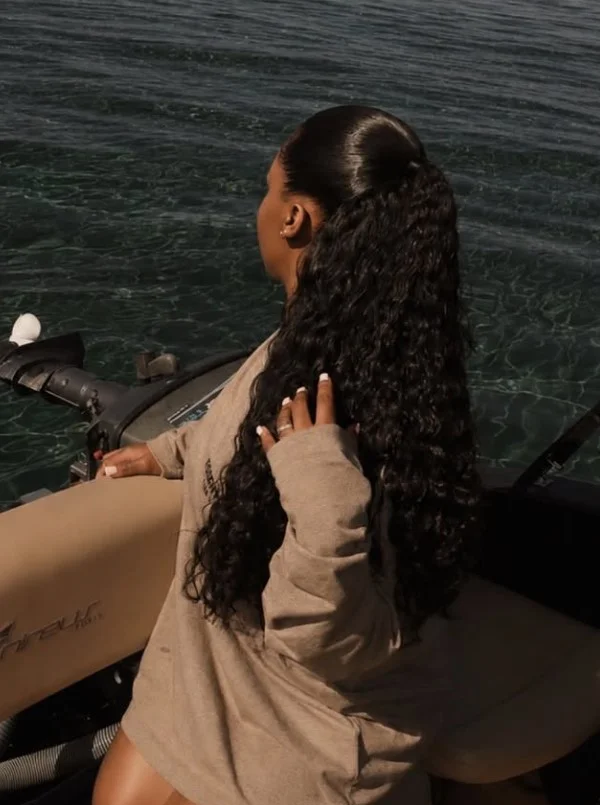 curly beach ponytail hairstyle for long curly hair