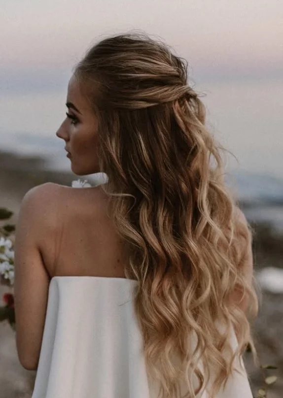 half up curly beach hairstyle for long curly hair