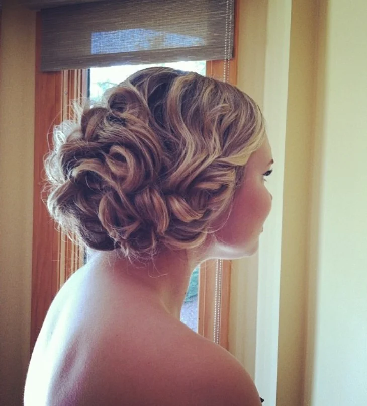 loose curly beach updo hairstyle for romantic summer look