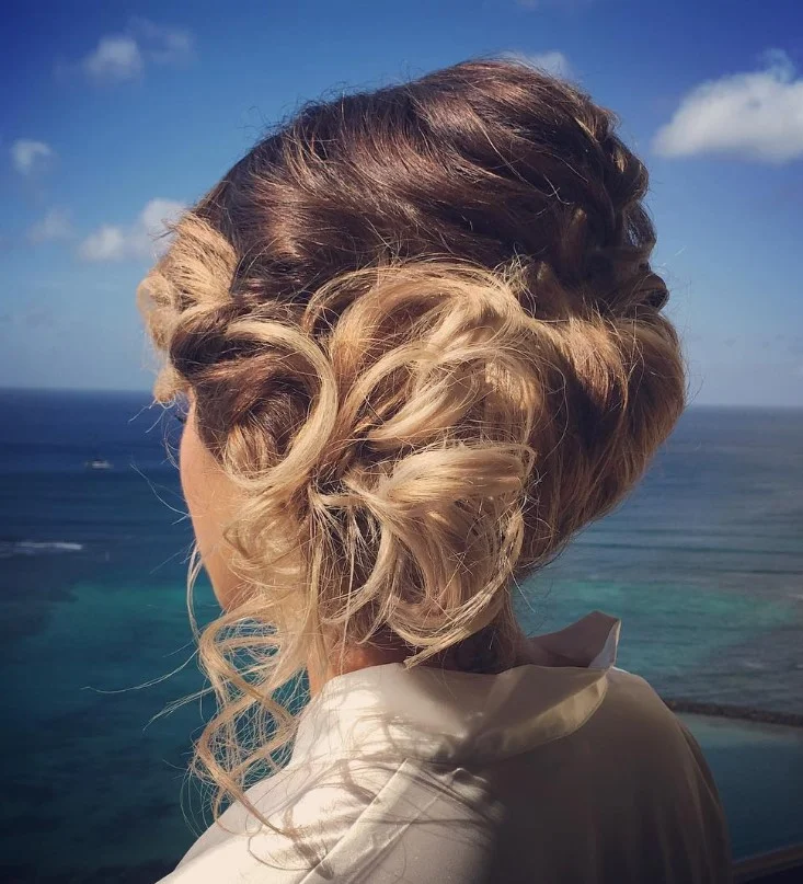 messy blonde beach updo hairstyle with textured volume