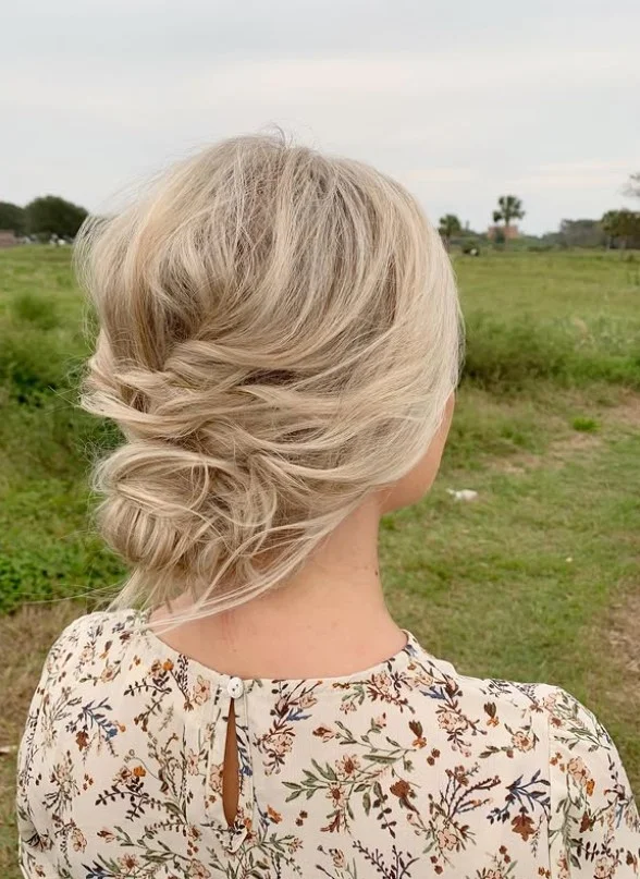 minimalist beach updo hairstyle with clean elegant finish