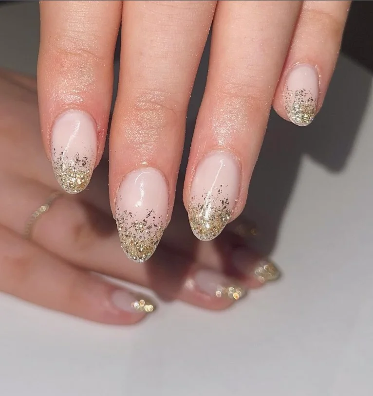 nude and gold glitter ombre almond nails luxury style