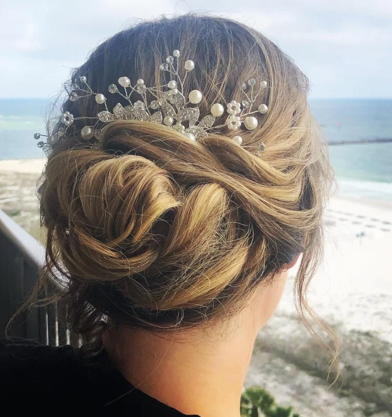 romantic beach updo hairstyle with soft beach waves