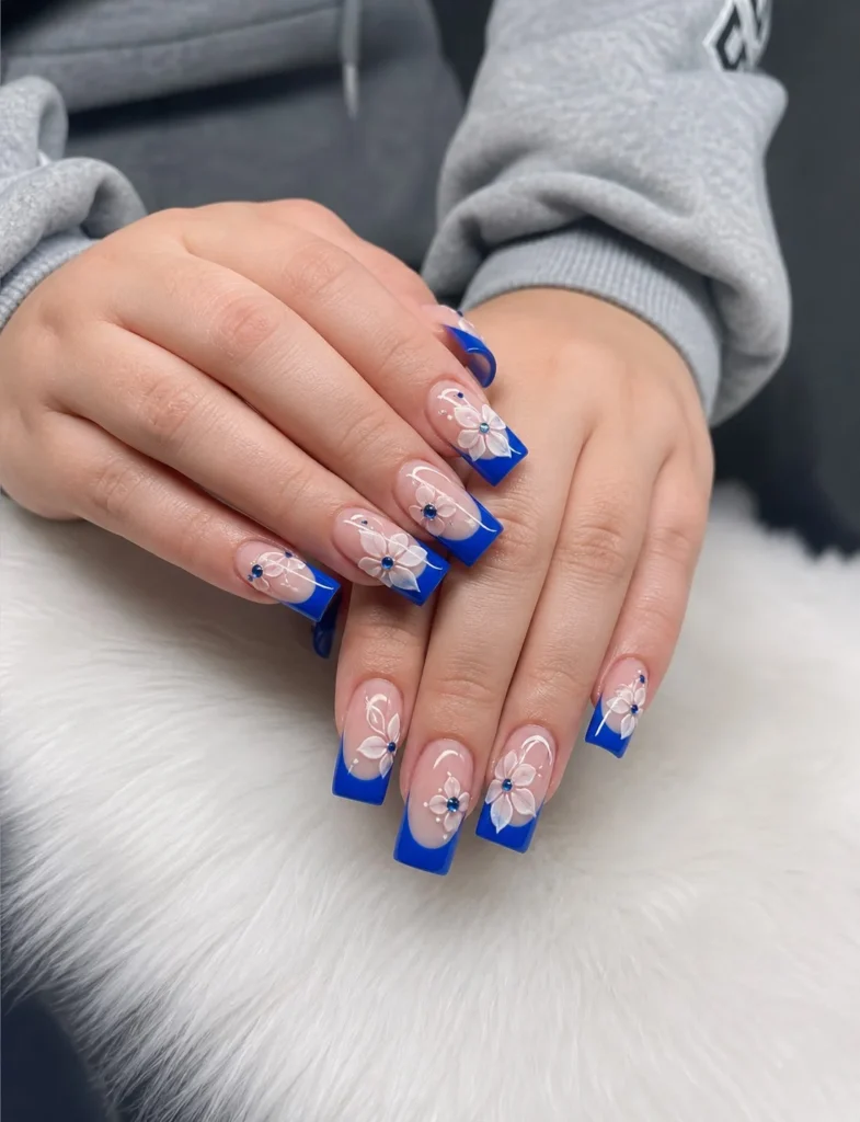 royal blue french tips with flowers soft look