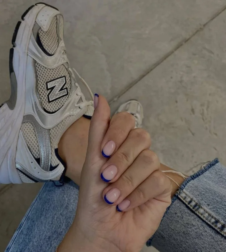 thin royal blue french tip nails minimal clean look