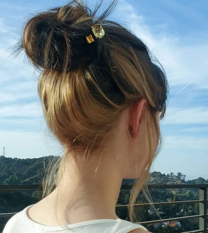 windswept beach updo hairstyle with natural movement