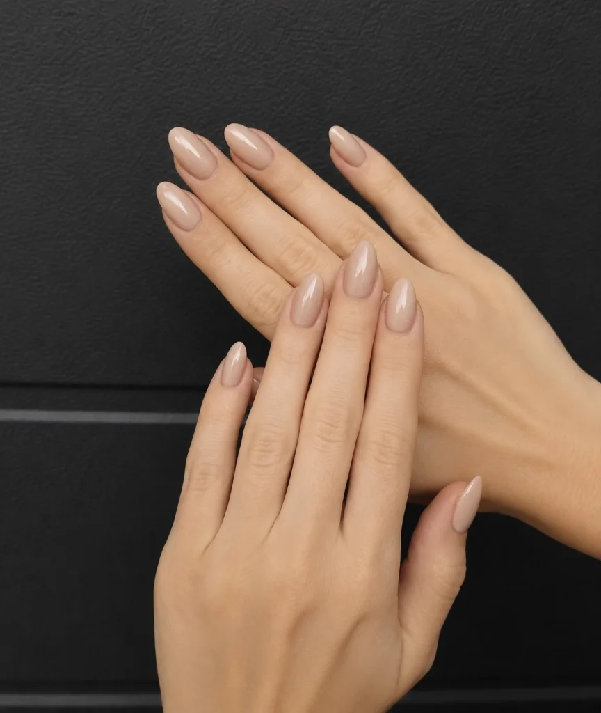 Almond milk nail design featuring creamy neutral brown shades and glossy finish.