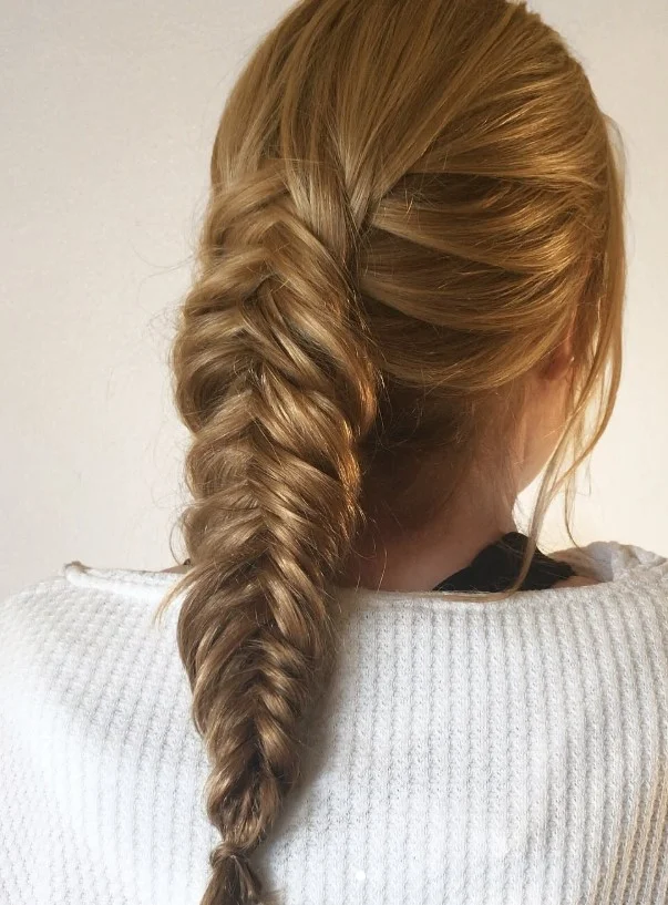 fishtail braid hairstyle for long hair beach vacation look