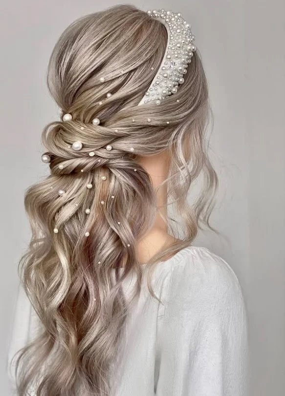 long beach waves hairstyle with pearl accessories and soft texture