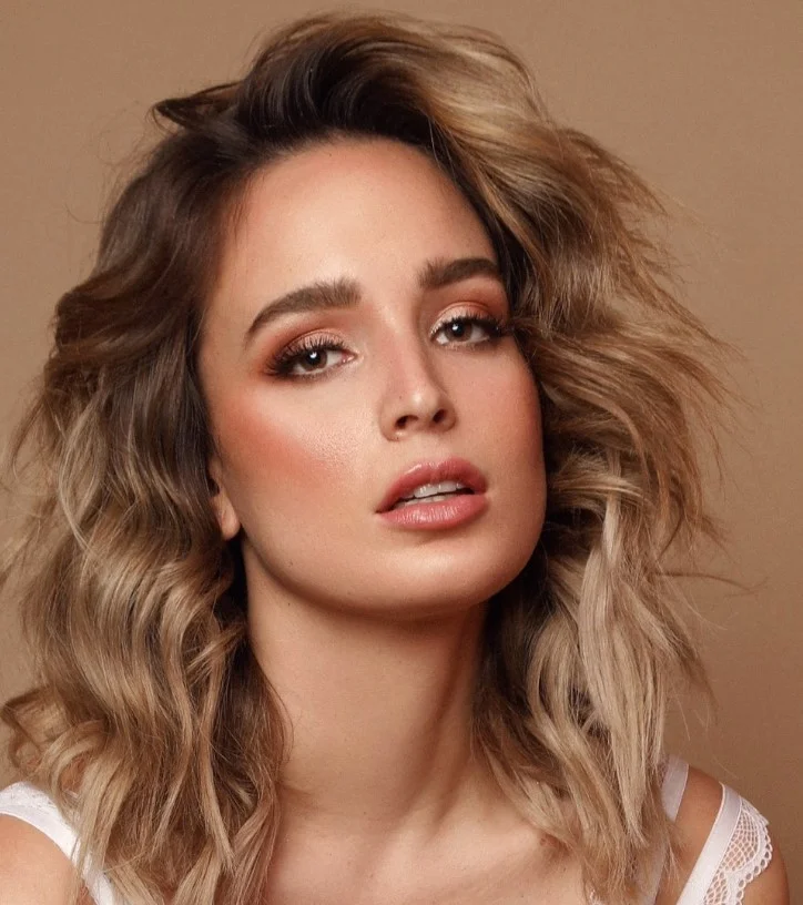 medium length beach waves hairstyle with soft layers