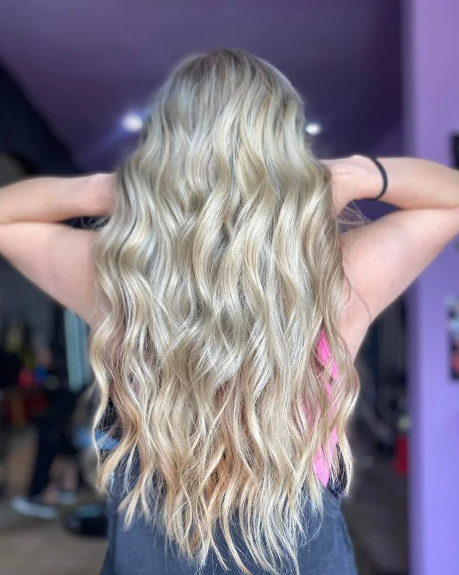 layered beach waves hairstyle with soft movement and volume