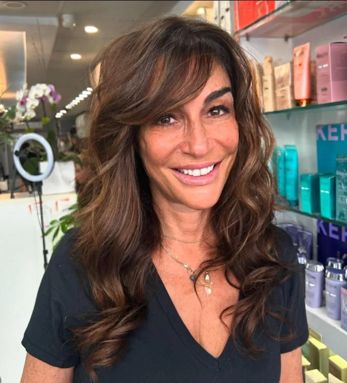 curtain bangs and beach waves hairstyle for medium length hair