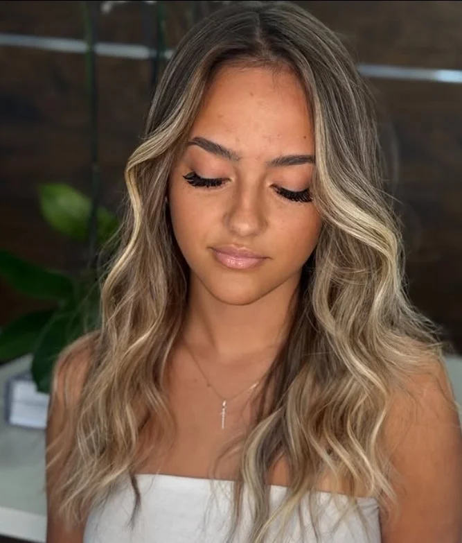 beach waves hairstyle with subtle highlights and natural texture