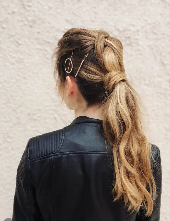 wrapped low ponytail hairstyle for beach wedding celebration