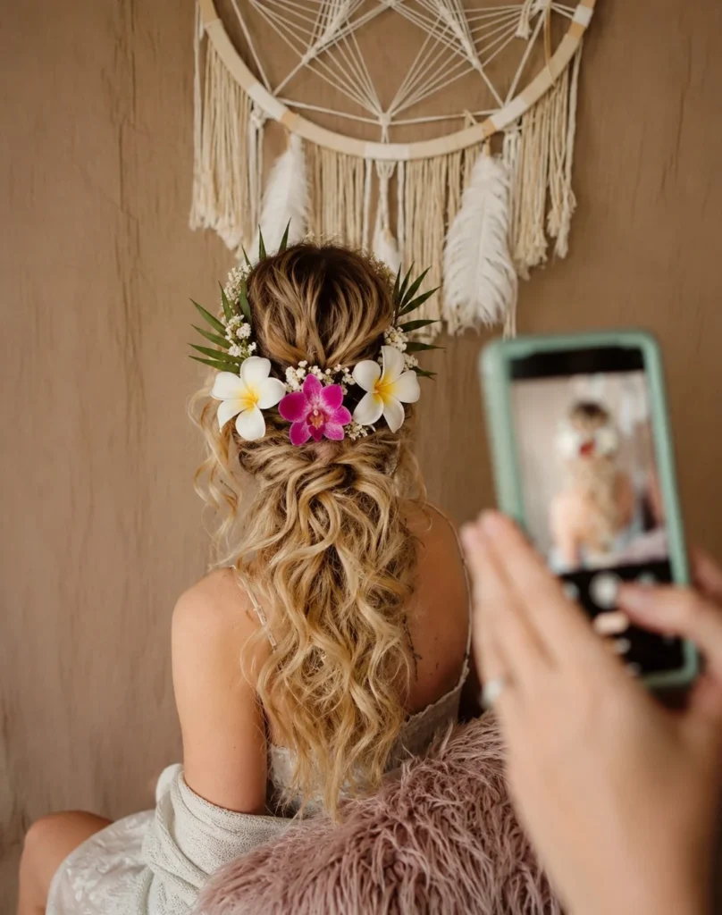 tropical flower half up hairstyle for seaside wedding guest