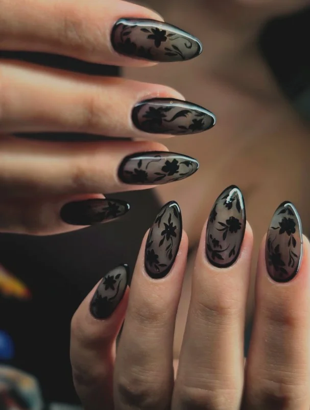 Black almond nails design with floral nail art soft feminine elegant style