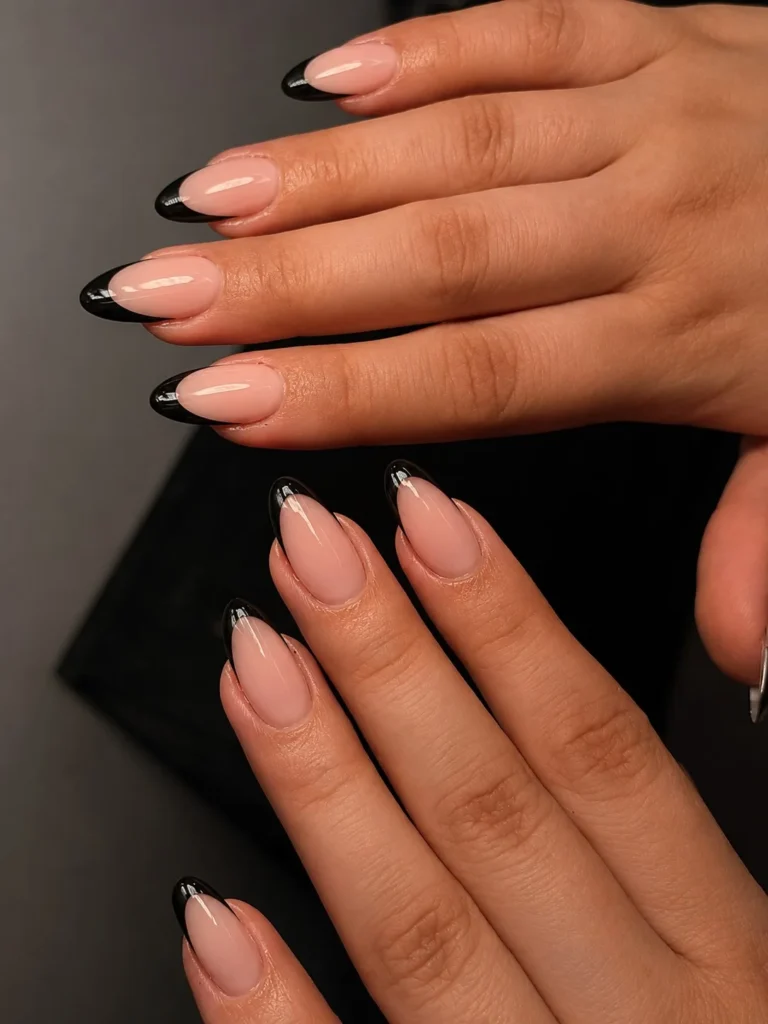 Black almond nails design with nude base elegant soft contrast nail art idea