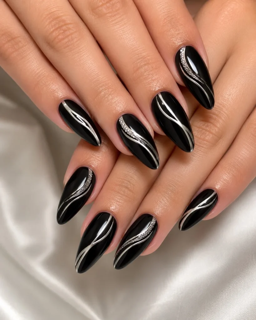 Black almond nails design with silver line details modern minimalist nail art style