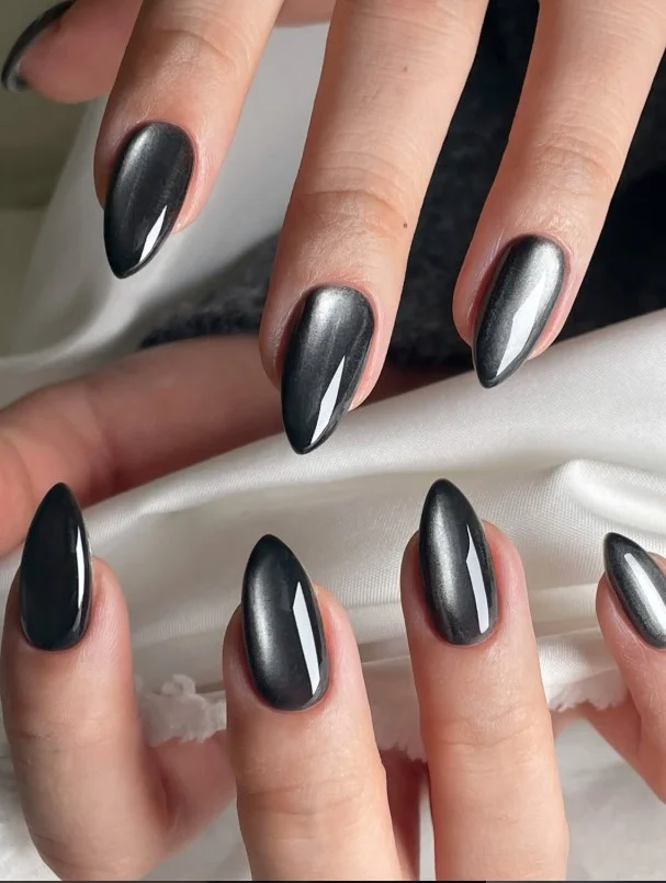 Metallic black almond nails design shiny bold futuristic fashion nail look