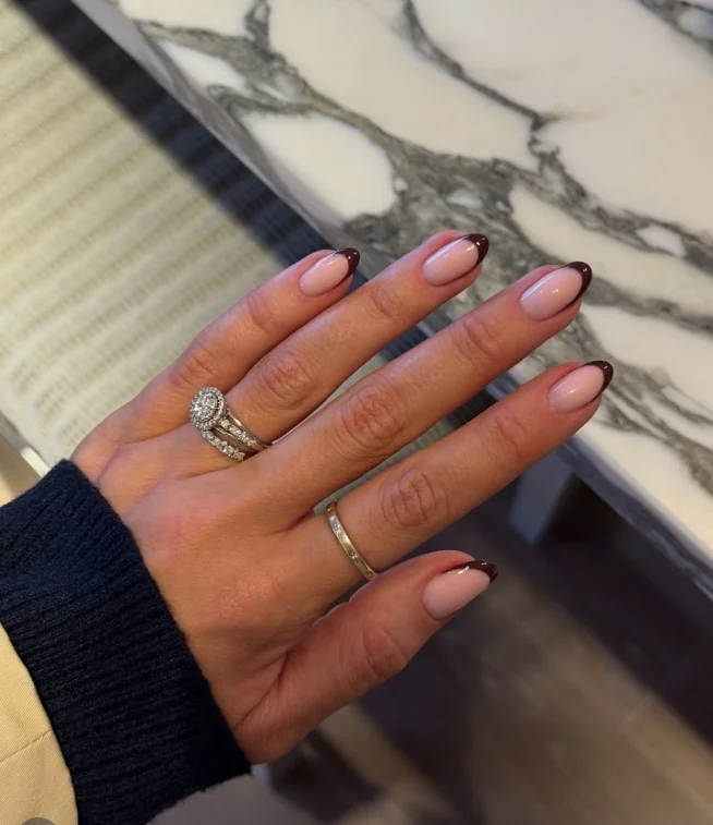 Short almond nails with brown French tips modern simple nail design elegant style