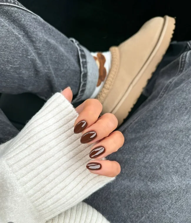 Chocolate brown short almond nails with warm rich tone and elegant minimalist style