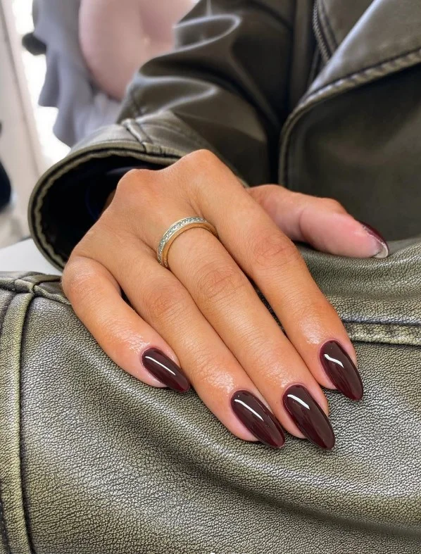 Warm cinnamon brown almond nails styled for cozy seasonal look.