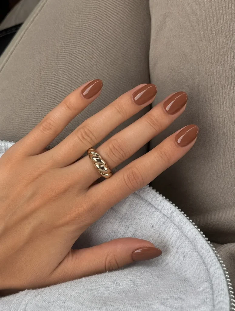 Cinnamon brown short almond nails warm cozy fall inspired manicure design