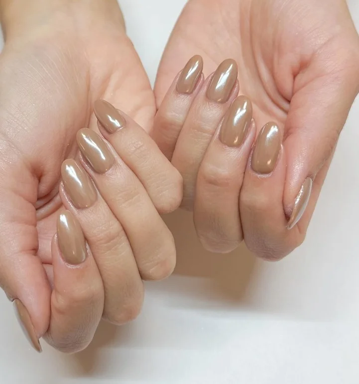 Creamy toffee almond nails with a rich light brown color and smooth finish.