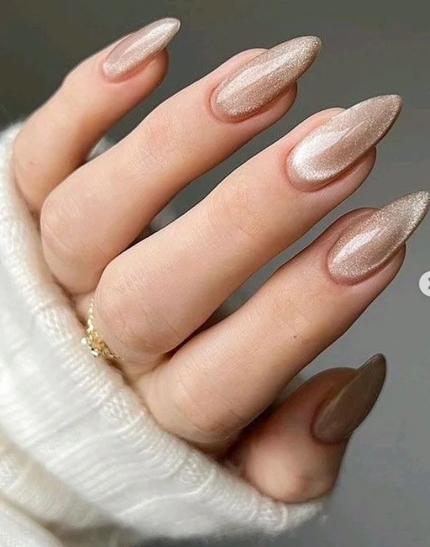 Champagne shimmer elegant classy almond nail designs with subtle sparkle