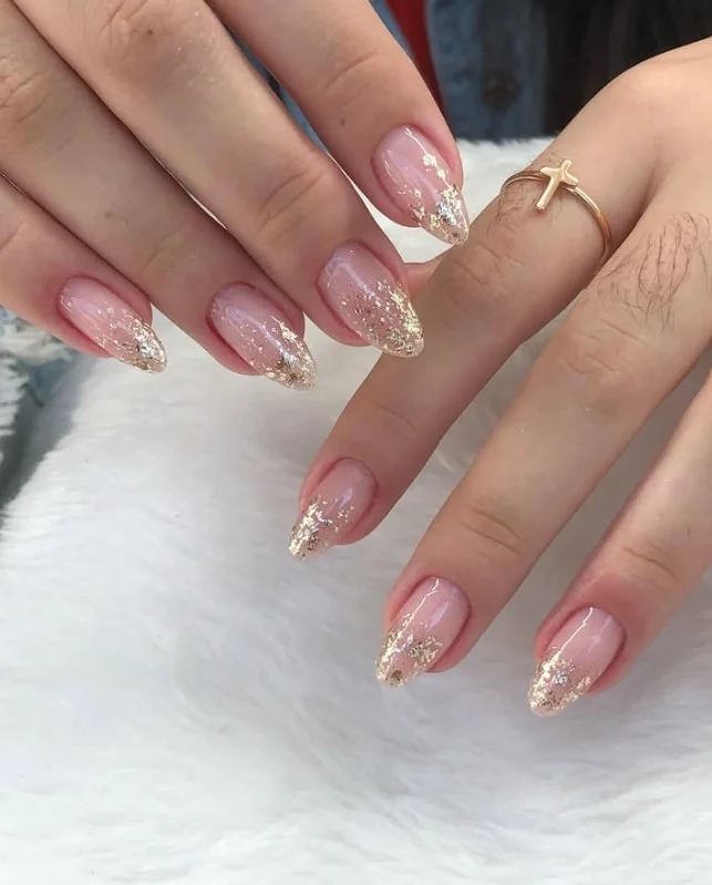 Elegant classy almond nail designs featuring luxury gold foil details