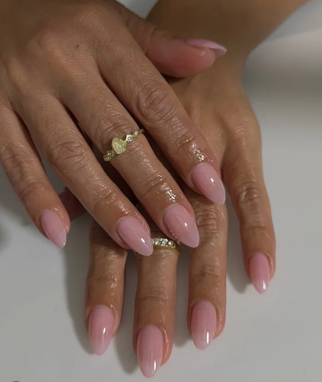 Sheer pink elegant classy almond nail designs with natural polished appearance
