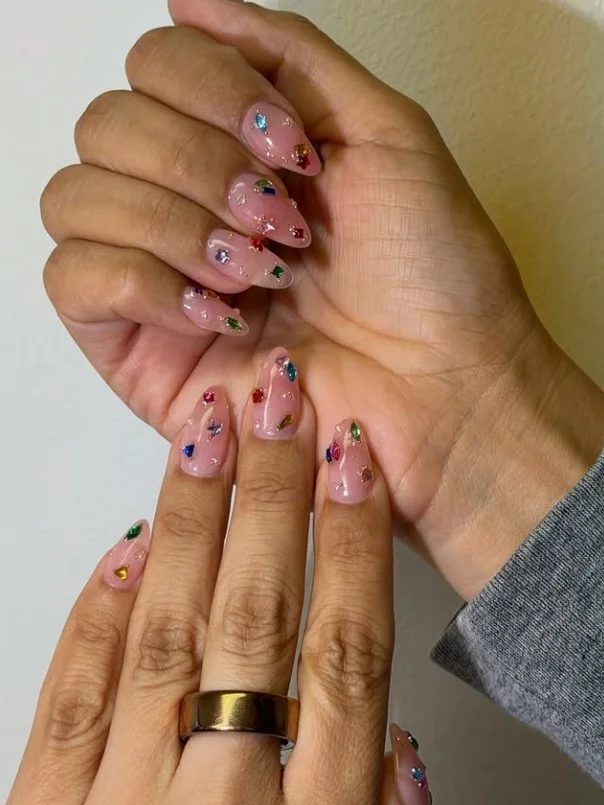 Elegant classy almond nail designs decorated with tiny crystal accents