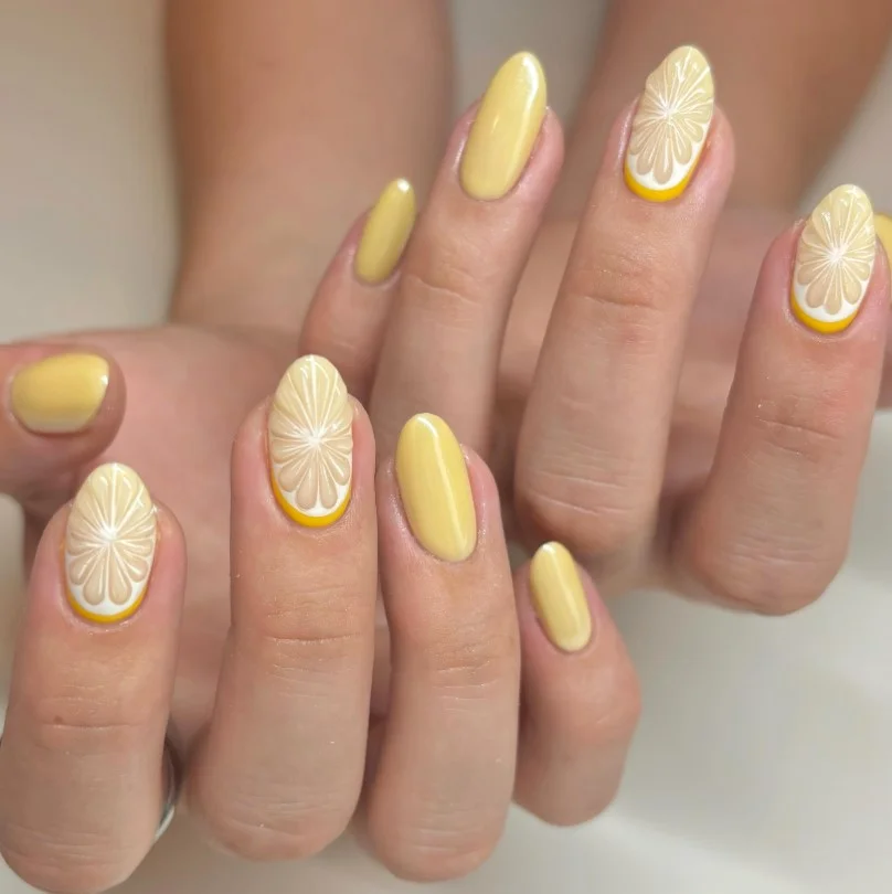 Bright lemon slice summer 3D nail designs with glossy yellow polish and fruit details.