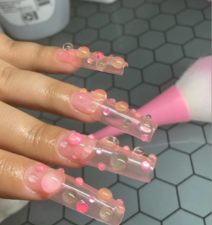 Trendy jelly bubble summer 3D nail designs with glossy transparent nail art.