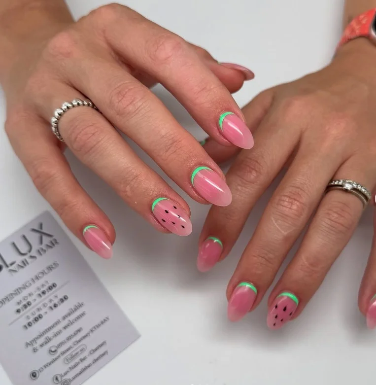 Fun watermelon summer 3D nail designs with raised fruit slices and glossy pink nails.