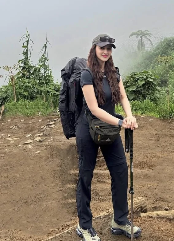 Matching hiking outfit with trail shoes for a stylish mountain trekking adventure.