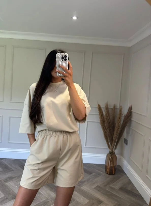 Monochrome beige shorts outfit featuring matching neutral pieces and elegant styling.