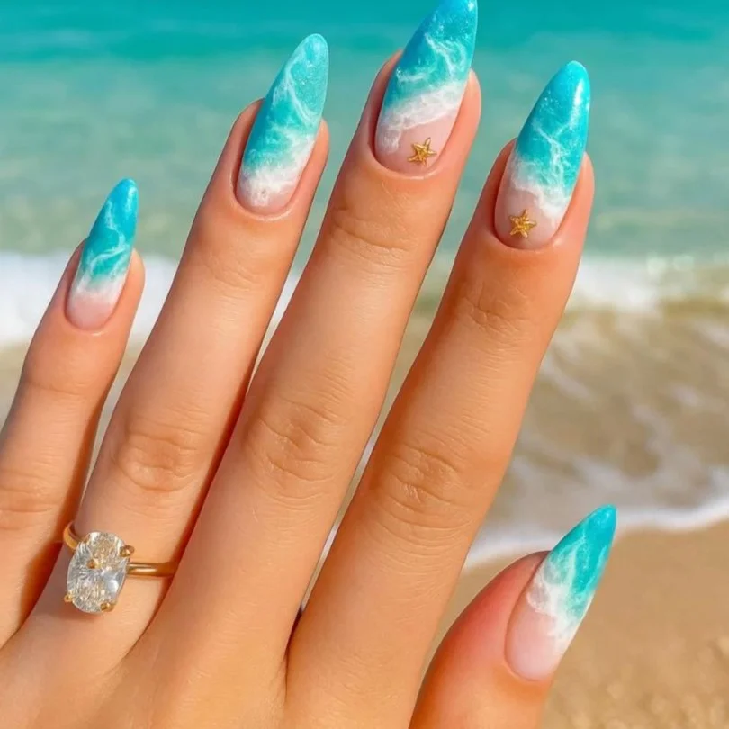 Ocean wave summer 3D nail designs with textured blue gel nail art.