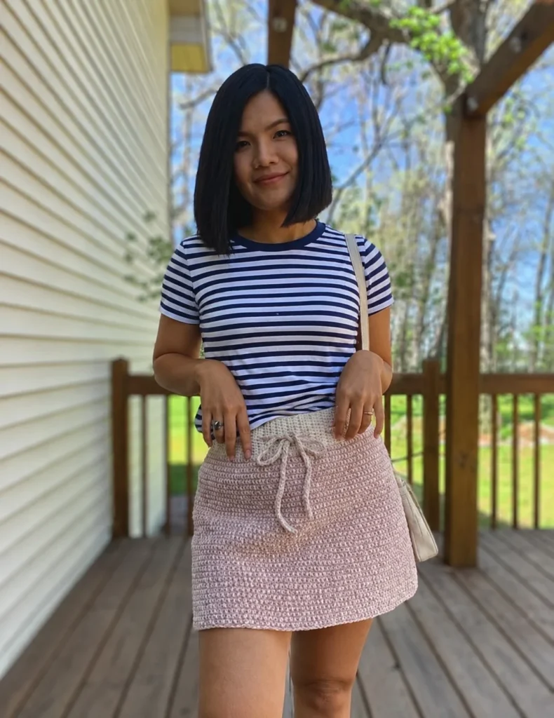 Striped tee paired with crochet mini skirt casual everyday outfit inspiration
