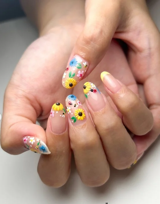 Bright sunflower summer 3D nail designs with raised yellow petals.