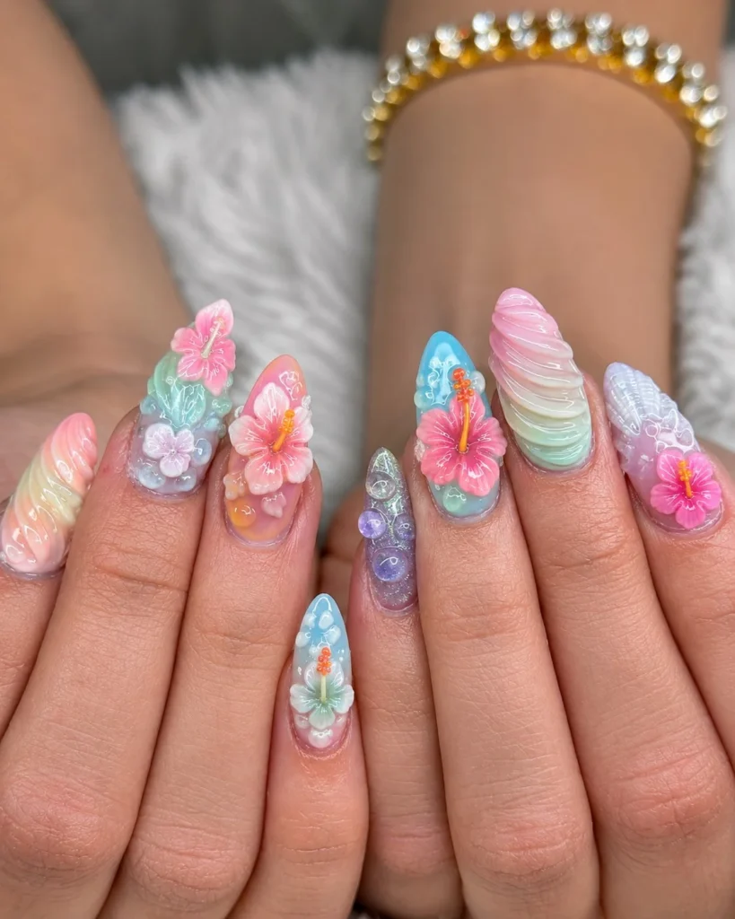 Tropical hibiscus summer 3D nail designs with raised pink flowers on glossy nude nails.
