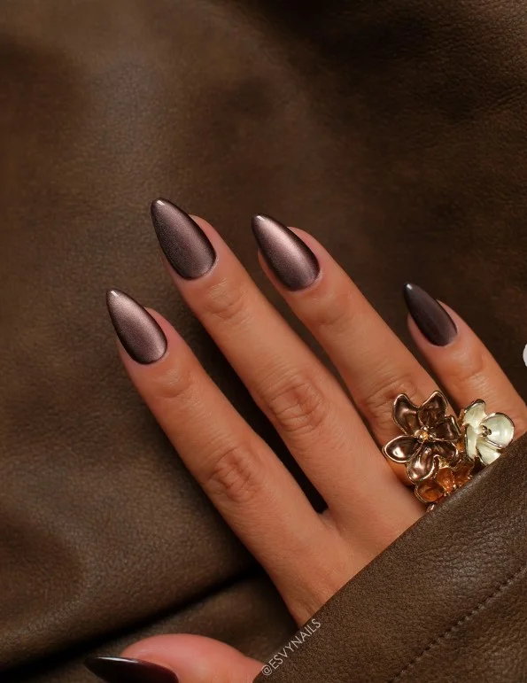 Luxury velvet-effect dark brown almond nails with soft glow finish.