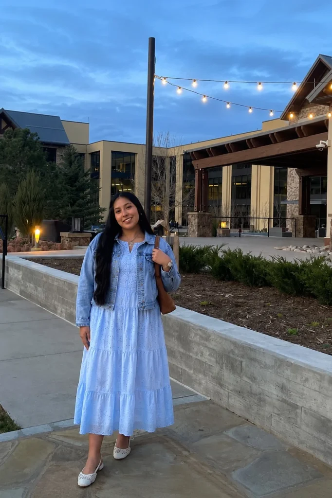 Baby blue dress outfit layered with a light denim jacket for cool spring evenings.