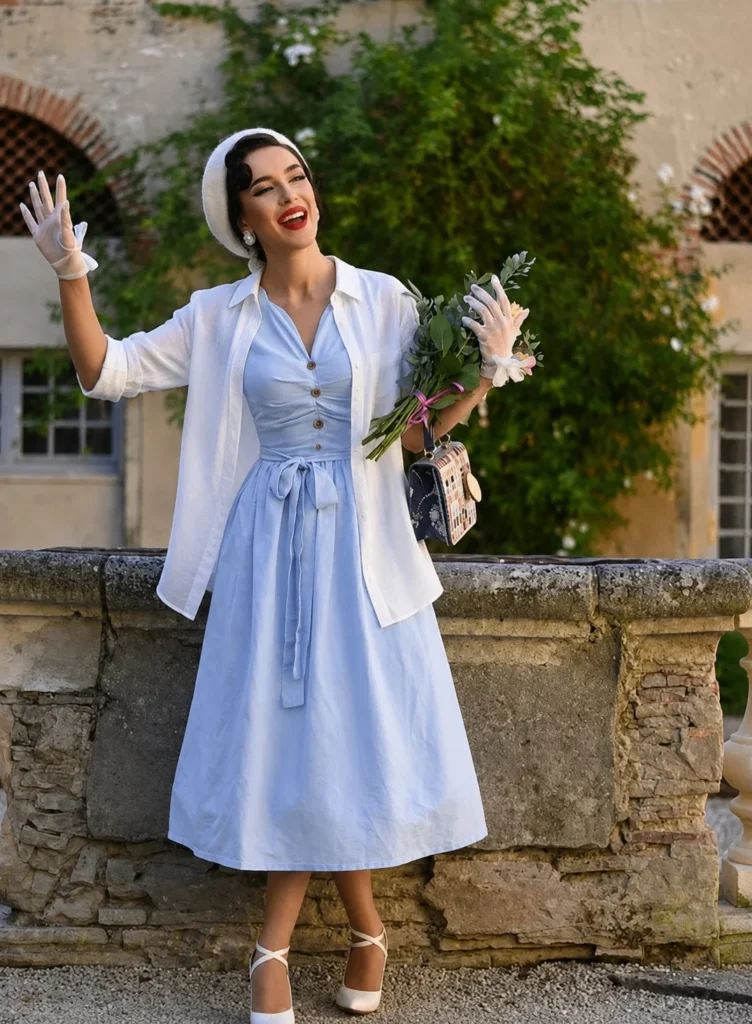 Baby blue dress outfit layered with an oversized white linen shirt for a relaxed style.