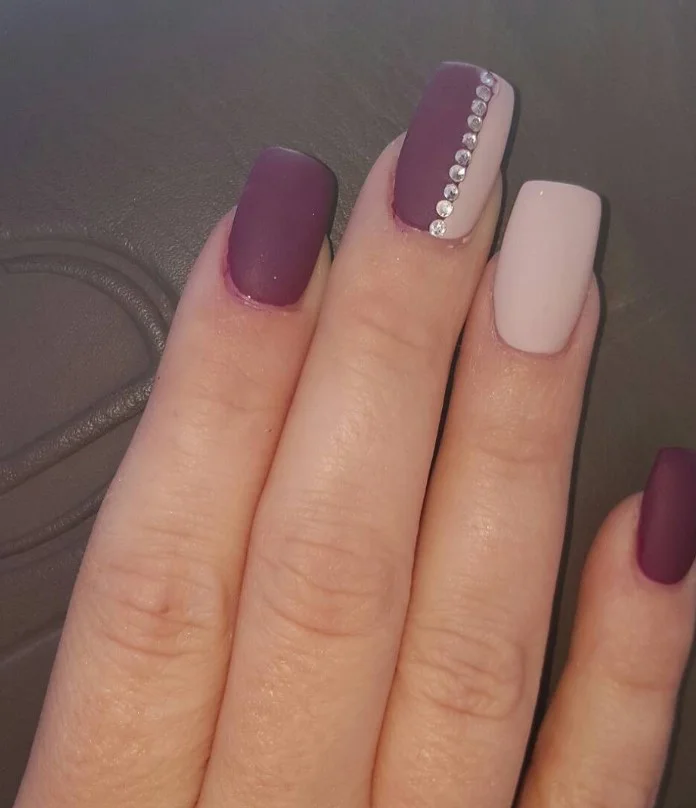Burgundy and nude fall nail designs featuring neutral tones with rich burgundy accents.