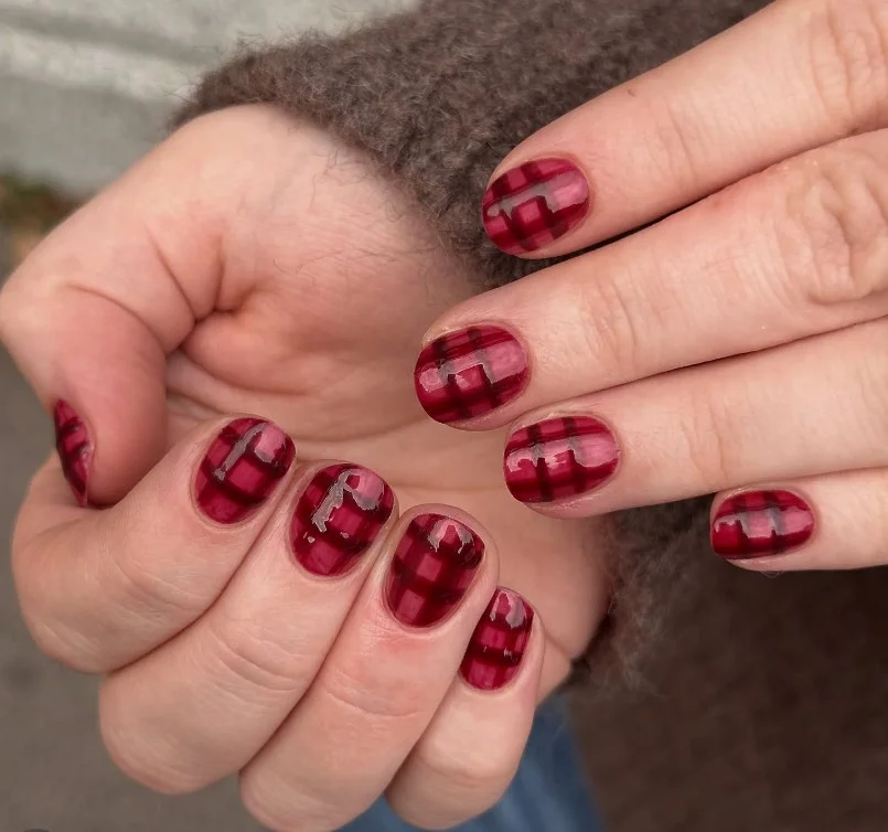 Burgundy plaid fall nail designs inspired by cozy autumn fabrics with fine plaid details.