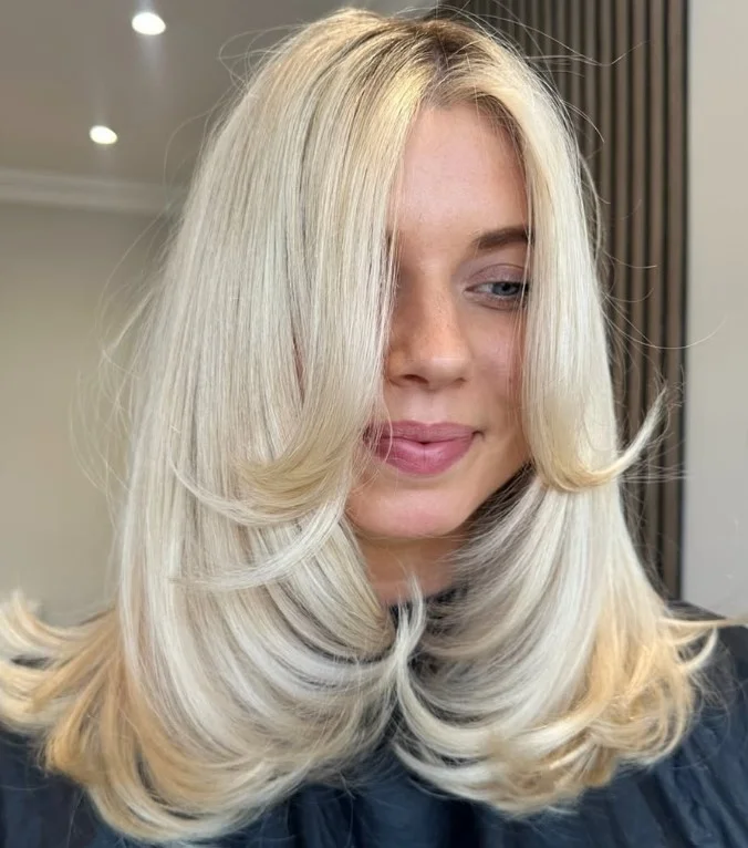 Butter blonde hair with creamy golden tones flattering a fair complexion.