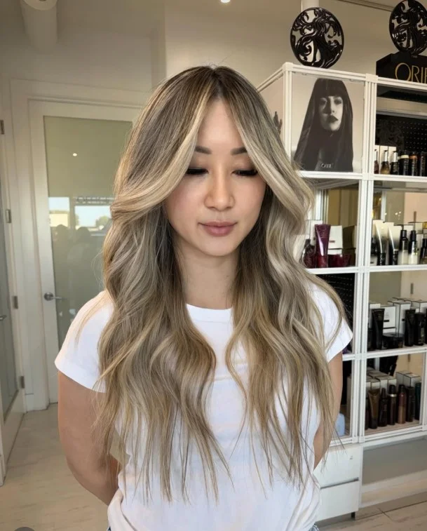 Champagne blonde hair with soft beige-gold tones for delicate fair skin.