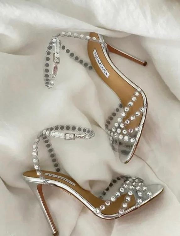 Champagne gold heels paired with a satin black dress for an evening celebration.